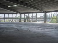 empty large open parking space with an area that looks out onto the countryside and outside