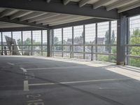 empty large open parking space with an area that looks out onto the countryside and outside