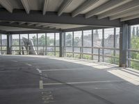 empty large open parking space with an area that looks out onto the countryside and outside