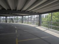 empty large open parking space with an area that looks out onto the countryside and outside