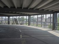 empty large open parking space with an area that looks out onto the countryside and outside