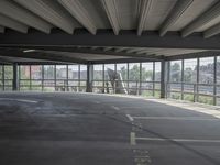 empty large open parking space with an area that looks out onto the countryside and outside