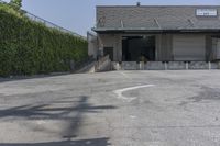 a parking lot with lots of concrete on the sides of it and no one walking into it