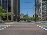 an intersection with buildings on both sides and a street light in the middle of the road