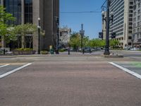 an intersection with buildings on both sides and a street light in the middle of the road