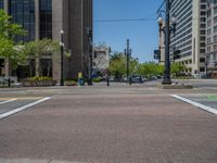 an intersection with buildings on both sides and a street light in the middle of the road