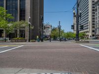 an intersection with buildings on both sides and a street light in the middle of the road