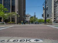 an intersection with buildings on both sides and a street light in the middle of the road