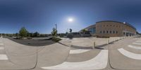 a photograph taken at the skate park in a reflection with a person on one side and another half at the bottom