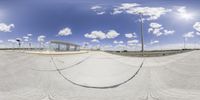 the skater takes a shot of the large skateboard park area in the sky above