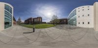 an image of a large circular image of buildings and the sky on a sunny day