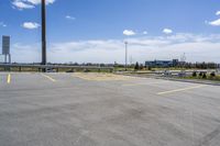 parking lot with parking lot in the background, near highway, traffic, and large building