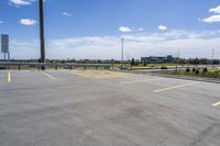 parking lot with parking lot in the background, near highway, traffic, and large building