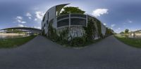 a 360 - view of a bike rider riding by an overpassed pedestrian bridge