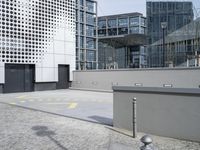 the view from a roof of an office building in london, england, with a parking sign and buildings