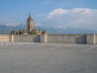 several large empty parking spaces in the city with buildings nearby in front of them -