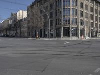 there is an empty street in the city center of the picture, but that does not have any vehicles to be seen