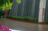 an image of flowers on the ground at the entrance to a water feature at universal world resort