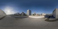 a couple of buildings sitting in the middle of a city sidewalk of skateboarding ramps