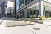 an empty sidewalk with planters in the middle of the street in the city of atlanta