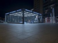 the building is located on one side and on another side is an illuminated sign reading'palmer plaza '