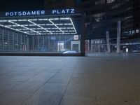 the building is located on one side and on another side is an illuminated sign reading'palmer plaza '