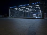 the building is located on one side and on another side is an illuminated sign reading'palmer plaza '