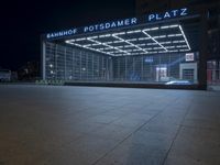 the building is located on one side and on another side is an illuminated sign reading'palmer plaza '