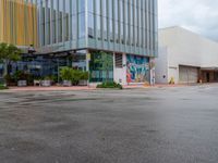 a picture of the outside of a shopping center in front of the road and the sidewalk