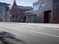 an empty street and an outside building on an urban day with a red and silver exterior