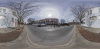 two images showing a city street in different directions and sizes, as viewed from a fish eye lens