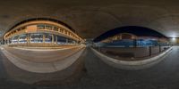 a view from underneath a bridge looking at two spherical objects in the same place with different lights on