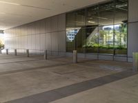 there is a large courtyard that looks like an outside space with stone columns and glass doors