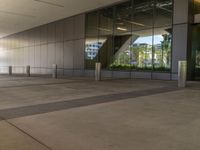 there is a large courtyard that looks like an outside space with stone columns and glass doors