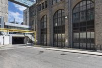 the entrance to an empty city street in downtown detroit, michigan, usa on a sunny day