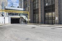 the entrance to an empty city street in downtown detroit, michigan, usa on a sunny day