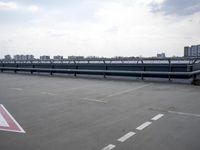 a boat is parked in an empty parking lot near an air port on the water