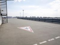 a boat is parked in an empty parking lot near an air port on the water