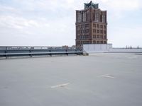 a boat is parked in an empty parking lot near an air port on the water