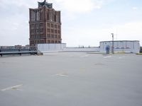 a boat is parked in an empty parking lot near an air port on the water