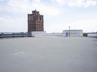a boat is parked in an empty parking lot near an air port on the water