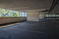 an empty parking garage is seen with the sun shining through the windows in this photograph