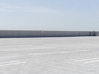 the top of a parking lot with no one going on it with no cars outside