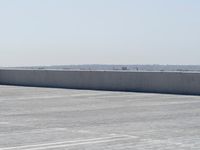 the top of a parking lot with no one going on it with no cars outside