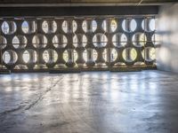 several barrels filled with different types of wine are in the warehouse room of a warehouse