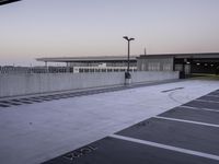Urban Parking Lot: Grey Asphalt and Concrete Structures