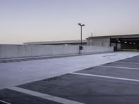 Urban Parking Lot: Grey Asphalt and Concrete Structures