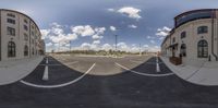 a parking lot is shown with two identical pictures on the same camera lens a sky full of clouds and some buildings with multiple levels