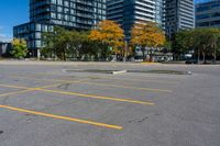 the empty parking lot is full of cars and buildings in the background, blue sky with white clouds