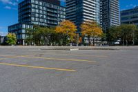 the empty parking lot is full of cars and buildings in the background, blue sky with white clouds